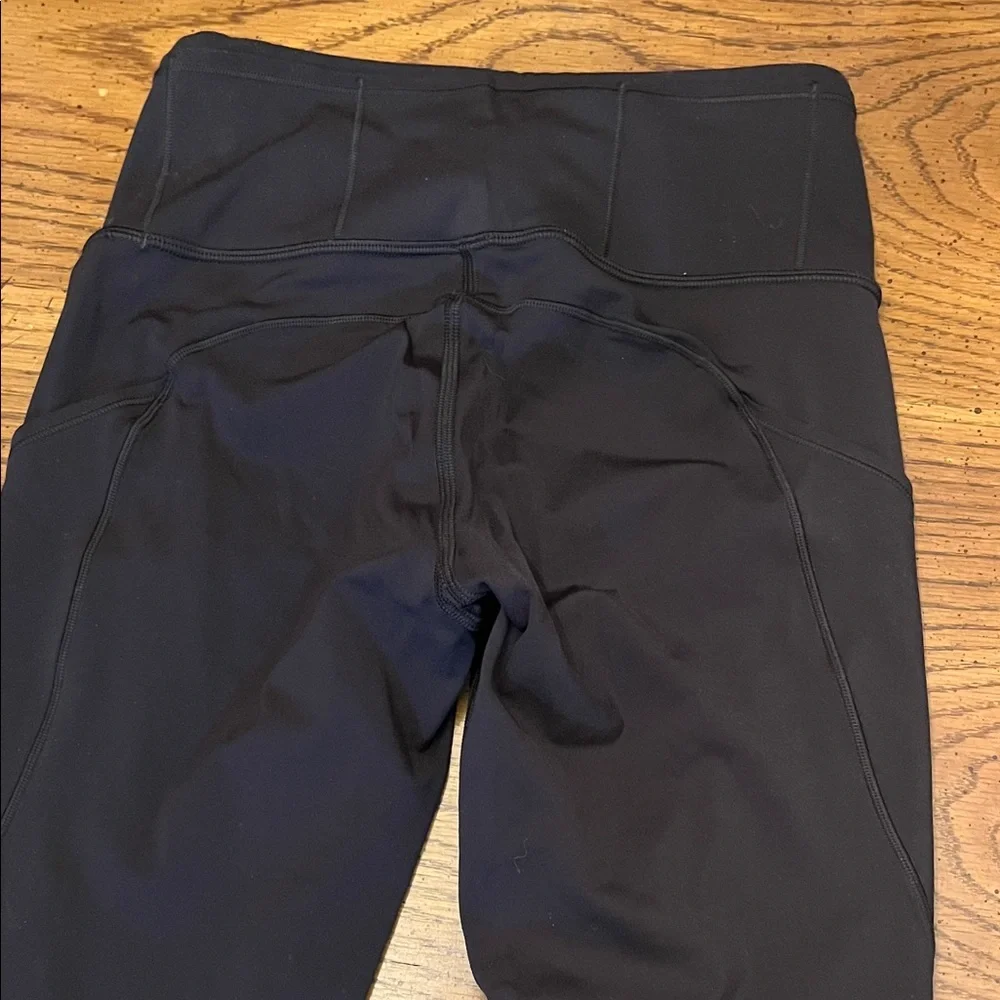 Lululemon Black High-Waisted 7/8 Leggings with‎ Reflective Detail, size 4